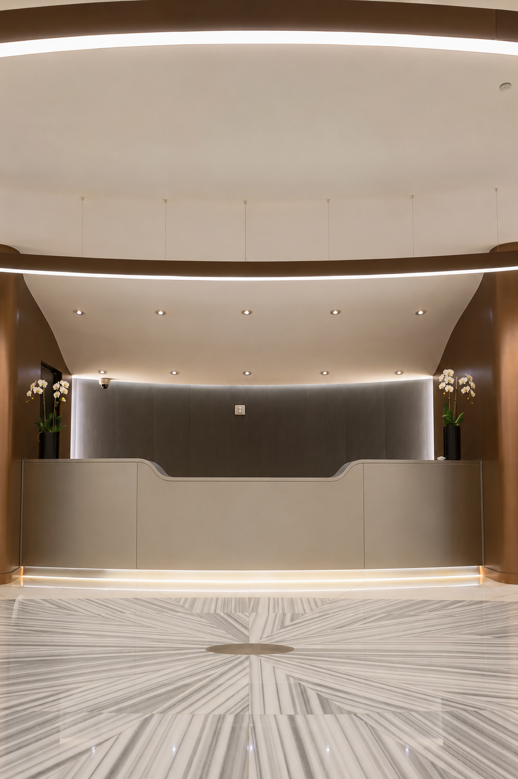 4000 Ponce reception desk with bronze detailing and marble floors